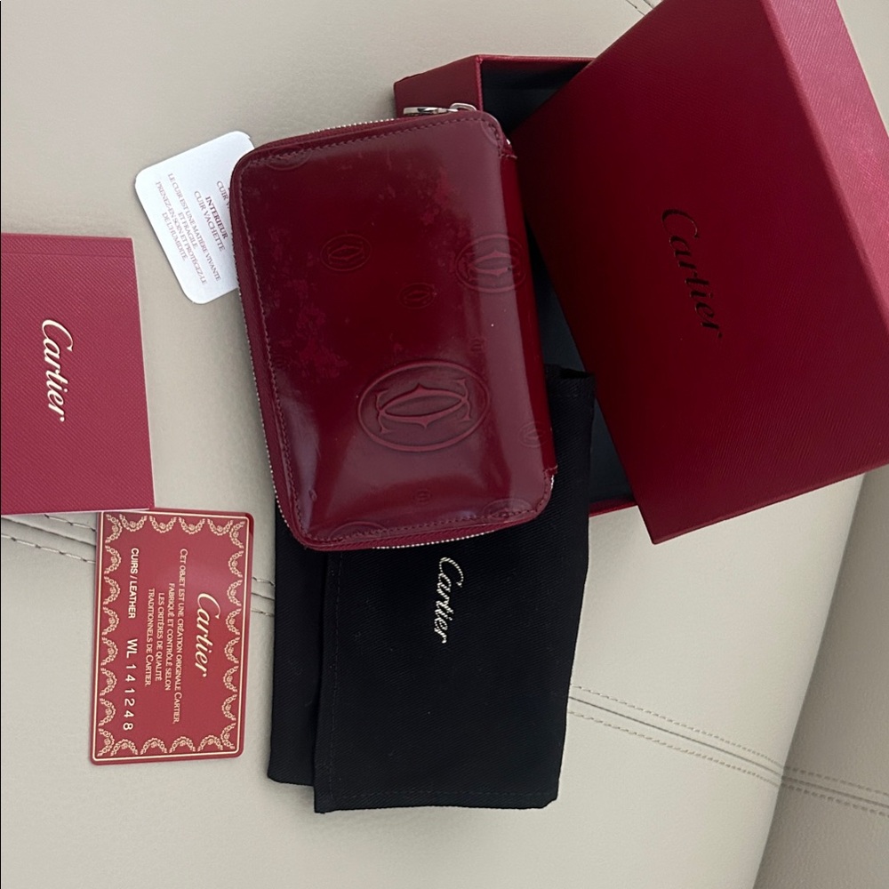 Cartier Red embossed leather zip around compact wallet